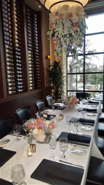 picture of Dallas Big Deal Room decorated for an event with orange, white and lavender floral