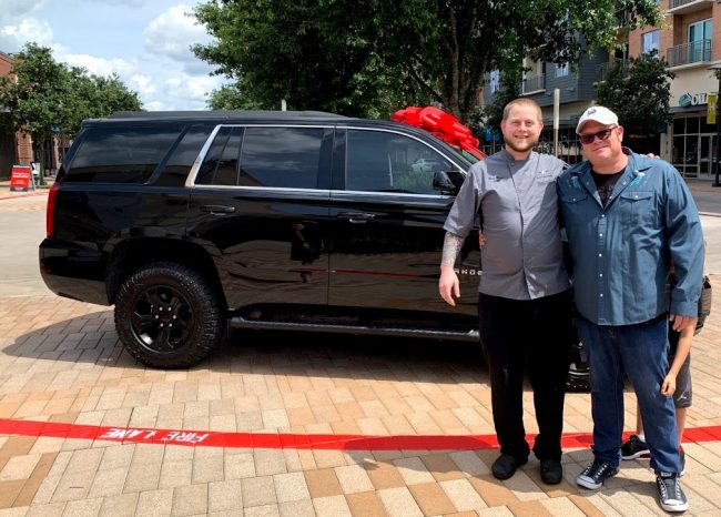 picture of Chef Shane Flynn and Chef Brian Wubbena when Shane made Chef partner and received his Chevy Tahoe.