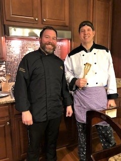 picture of Bond Davis with a server teammate at an in home dining event