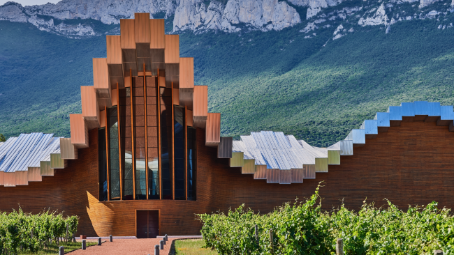 picture of a winery and mountains