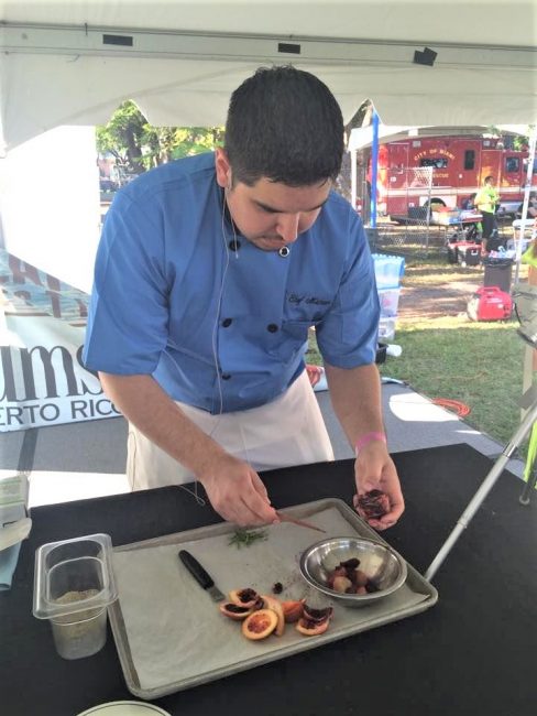 chef Michael Cerny prepping food at an offsite charity event
