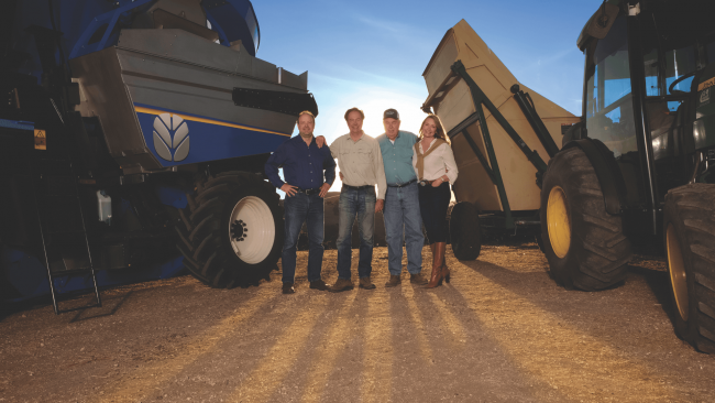 picture of J. Lohr family with their tractors