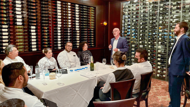 picture of the Truluck's Miami team learning about Petrossian caviar