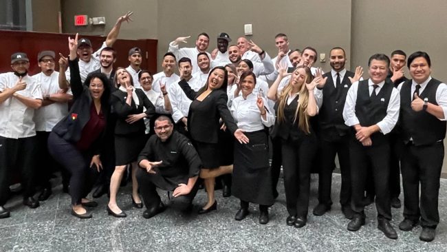 picture of Kim Vazquez with the Miami Truluck's staff being silly