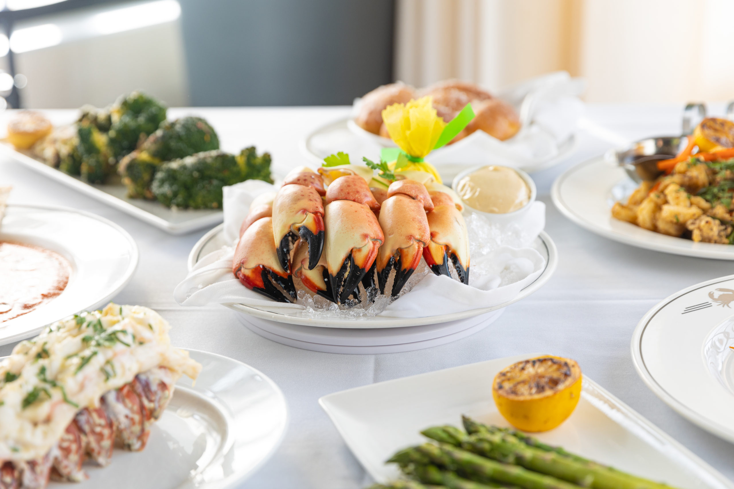 picture of fresh Florida stone crab claws with lobster tail, asparagus, calamari and broccoli