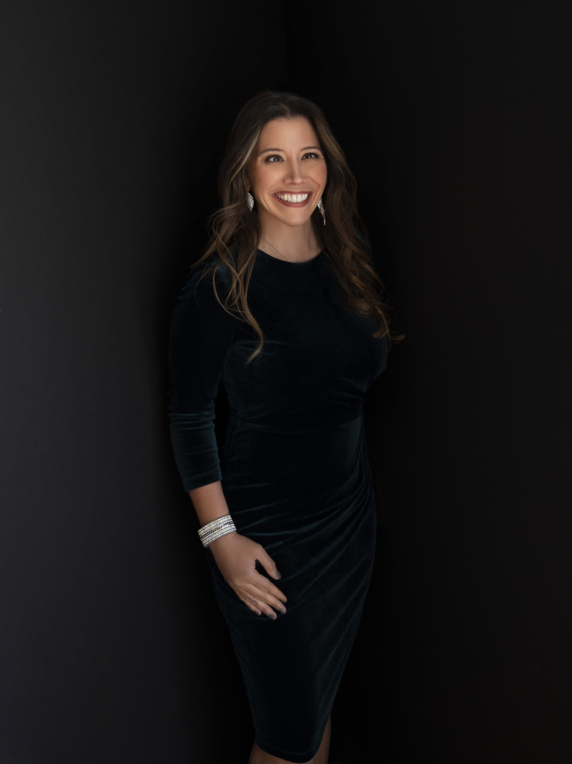 picture of event coordinator Amber Scheer in a velvet dress