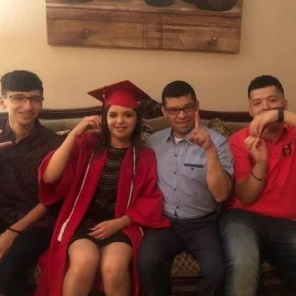 picture of Chef Misael with his daughter and sons celebrating graduation