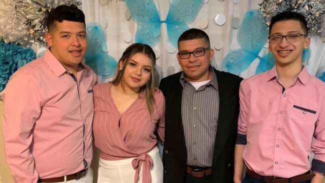 picture of Chef Misael with his Children at a wedding