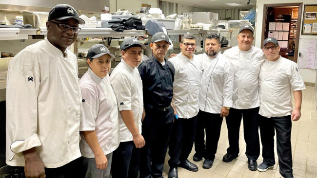 picture of Chef Misael with a few of his Houston kitchen team members