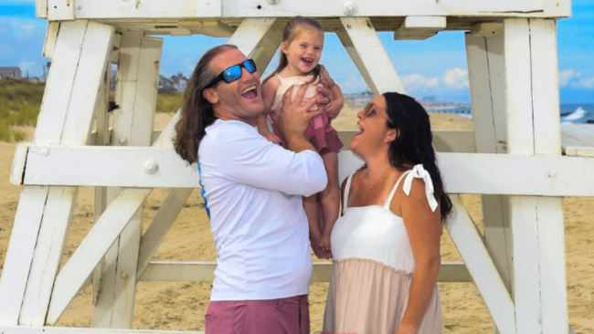 photo of Chef Travis with his wife and daughter on the beach