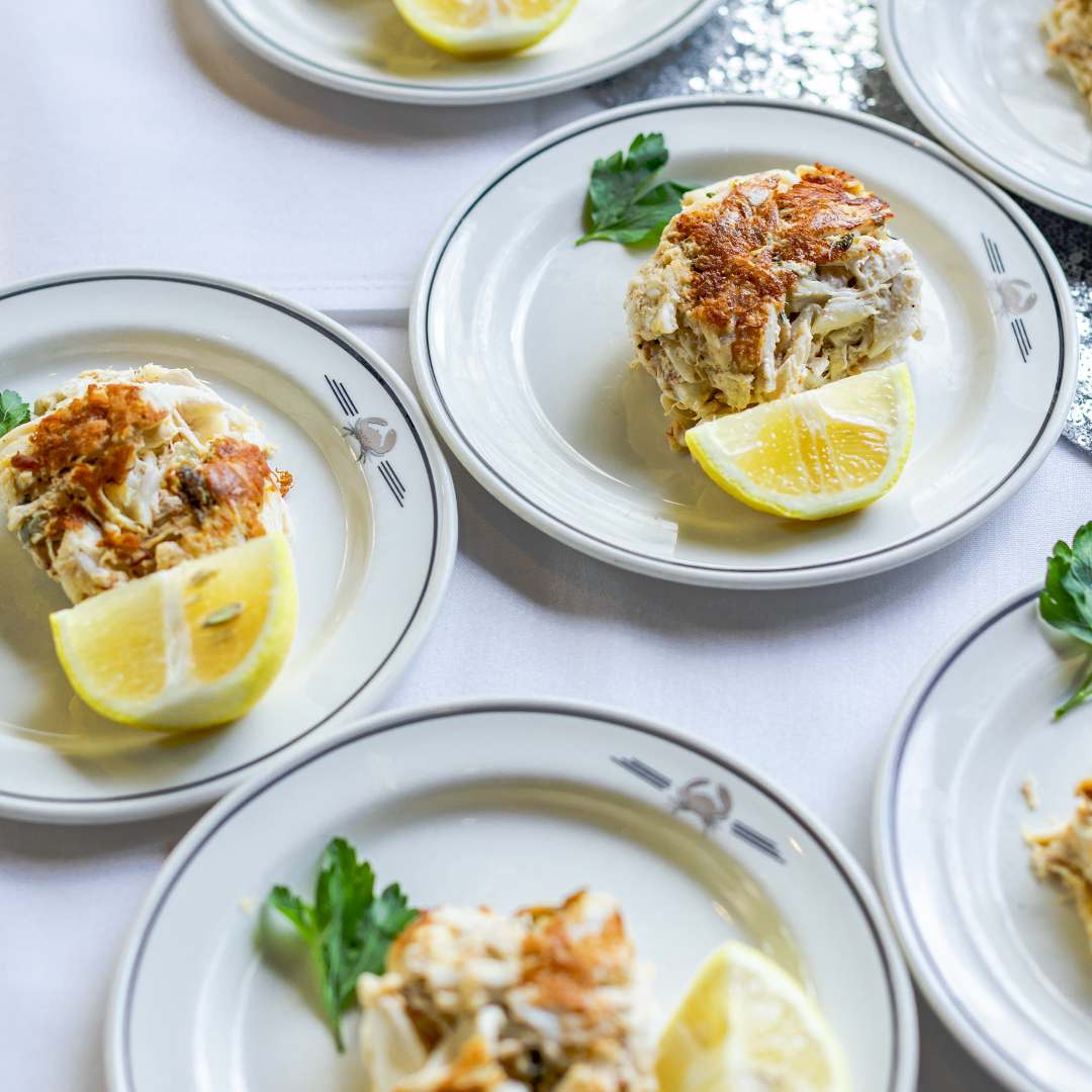 photo of jumbo lump crab cakes and crab logo B&B plates with fresh lemon