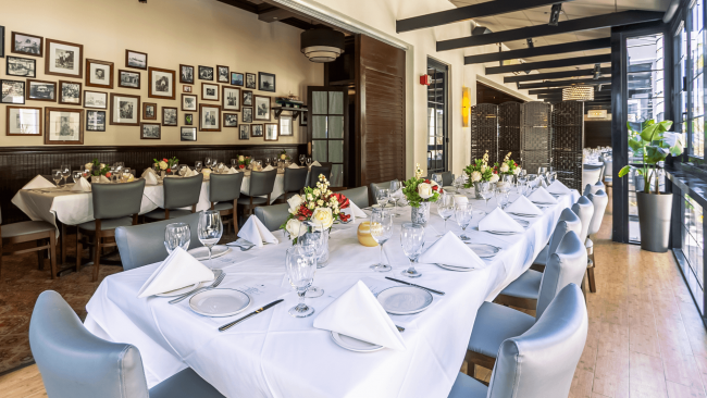 photo of a private dining room setup with fresh flowers