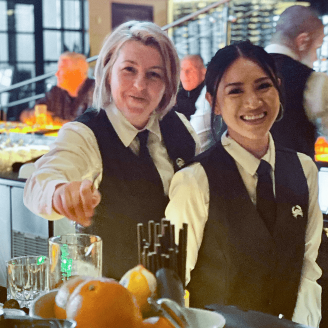 Truluck's Rosemont bartenders making drinks and smiling during the shift