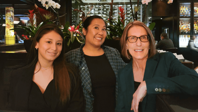 Truluck's Miami team smiling at the host stand