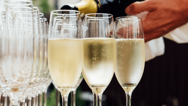 photo of 3 glasses of bubbly champagne being poured