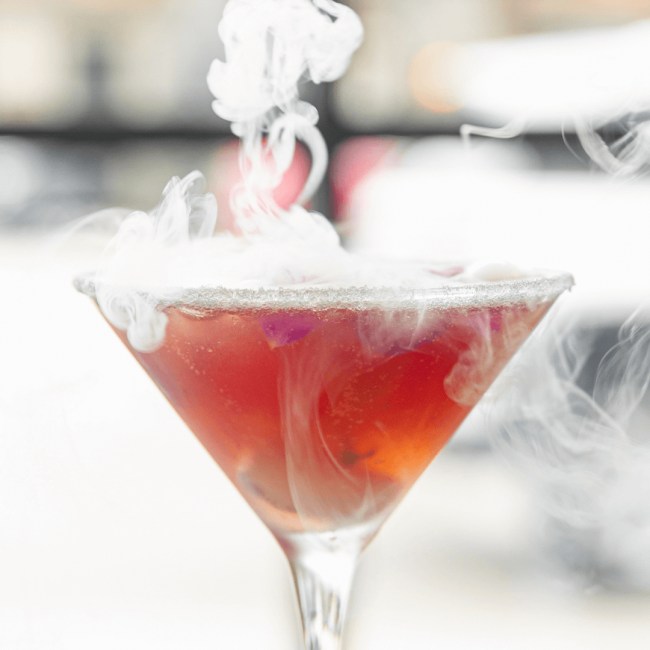 photo of the Voila! cocktail with smoking dry ice