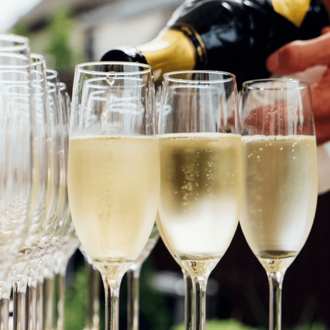 photo of 3 glasses of champagne being poured