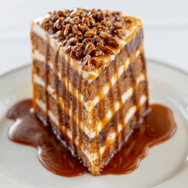 photo of Truluck's 4 layer carrot cake topped with caramel and pecans