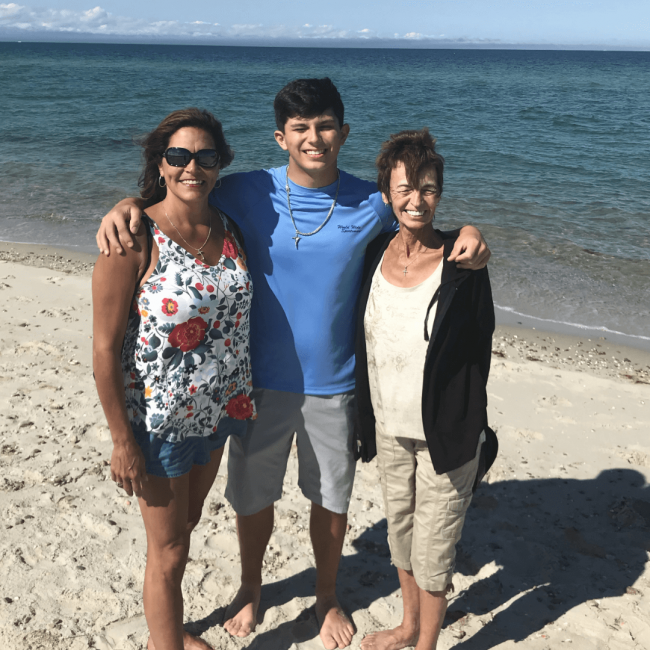 photo of Melissa with her son and her Mom at the beach