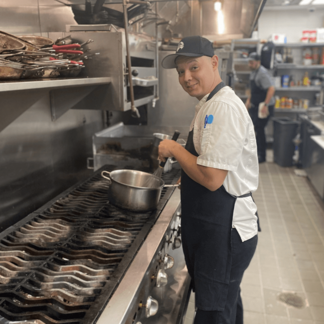 Chef Joe on the line whisking up some yumminess for the team