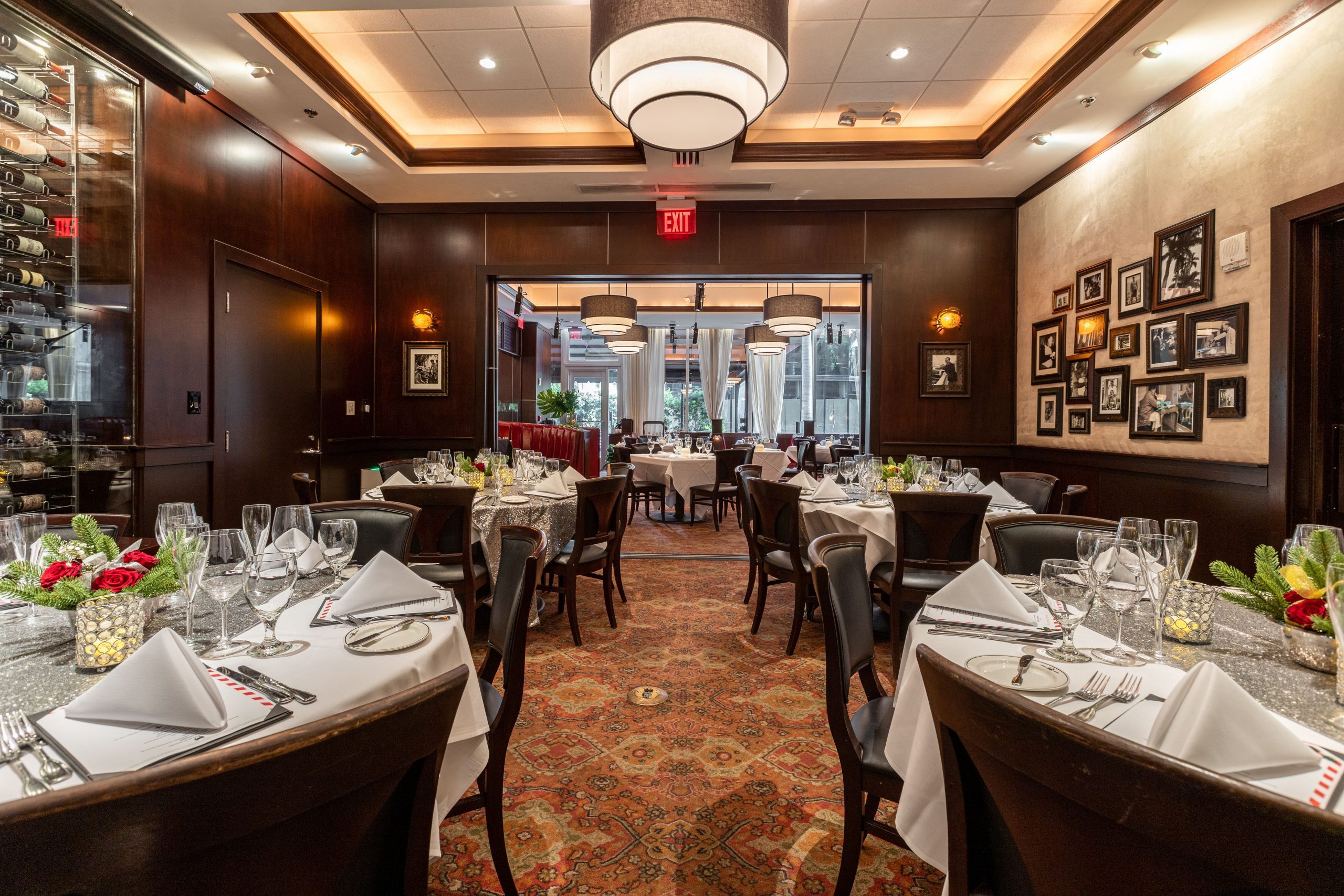 VIEW OF THE NAPLES ROOM LOOKING OUT INTO THE MAIN DINING SPACE. TABLES SETUP WITH ROUND TABLES