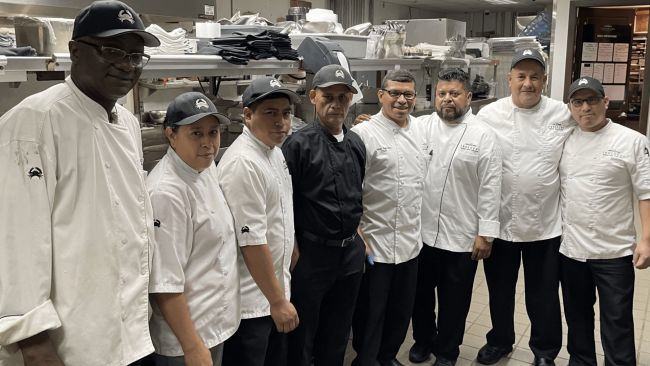 chef Misael with his team of line cooks in the kitchen at the Houston location.