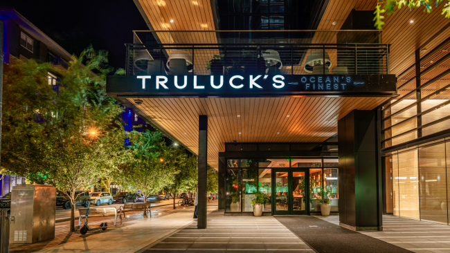 The exterior entrance of Truluck's Ocean's Finest Austin downtown location at nightime