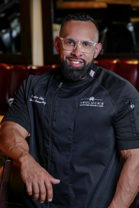 Chef Estephan in his Truluck's Chef coat in at the bartop in Naples