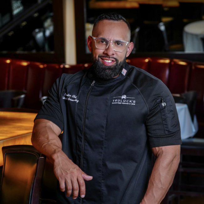 Chef Estephan in his Truluck's Chef coat in at the bartop in Naples