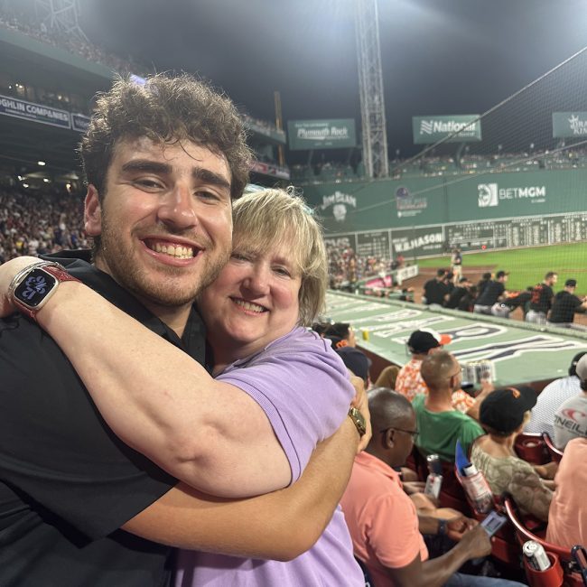 Sam and his mom at an MLB baseball game field