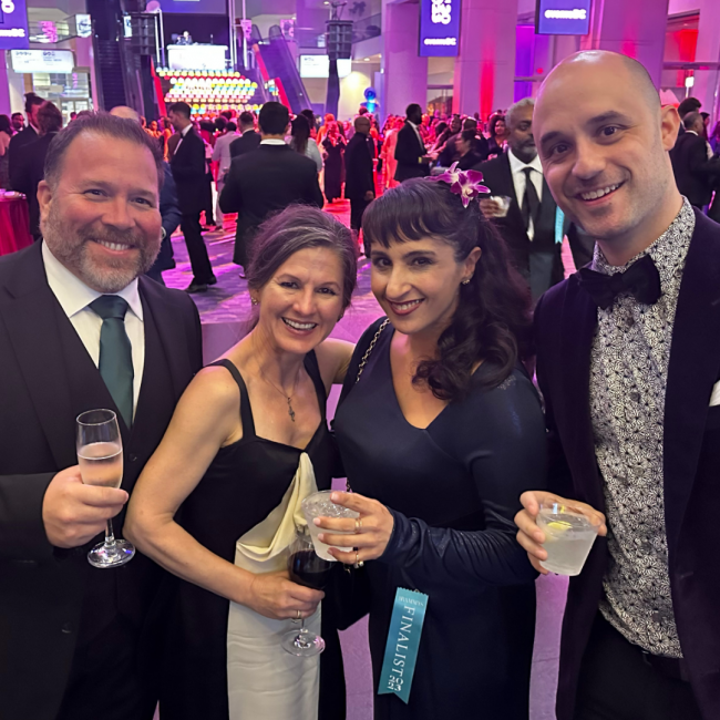 Shawn with the DC team dressed in evening attire in a ballroom at the Rammy awards