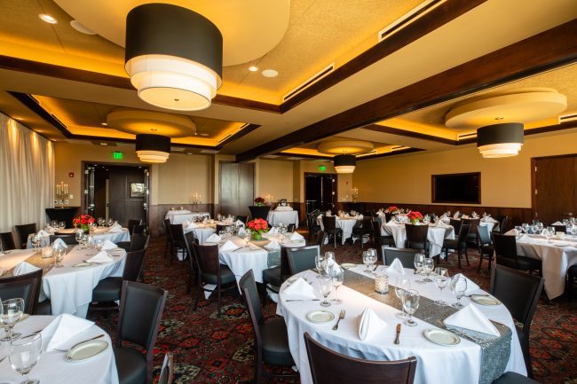 Truluck's Rosemont stone crab room view from the window side of the room looking toward the entry doors.