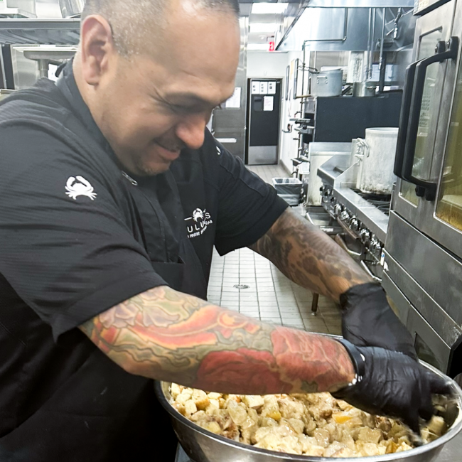 Chef Manny of DFW in the kitchen prepping something yummy