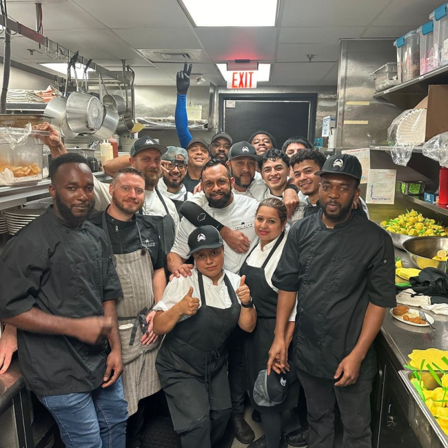 Chef Estephan of Truluck's Dallas with his culinary team in the kitchen