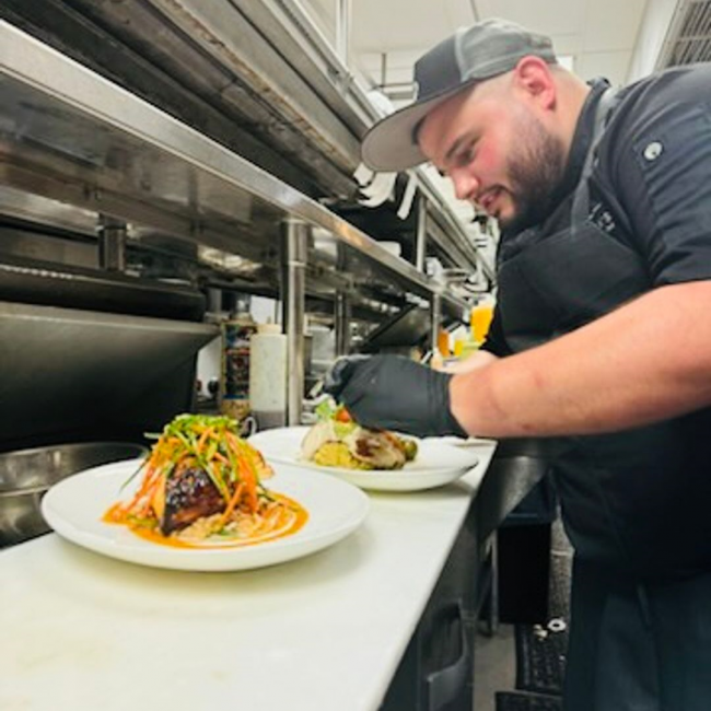 Sous chef Jonathan of Naples working on the line and plating up entrees