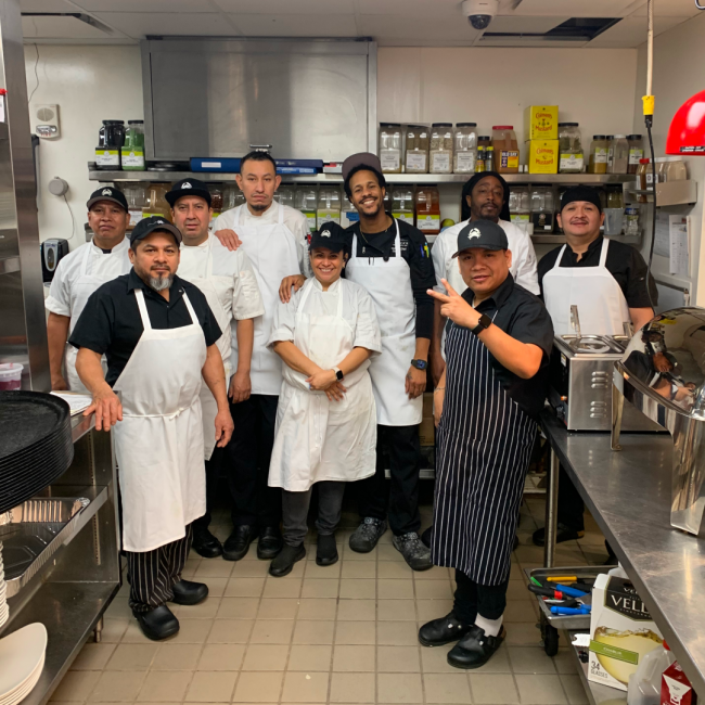 Chef Darryl and his kitchen team in DC in the back of house kitchen area