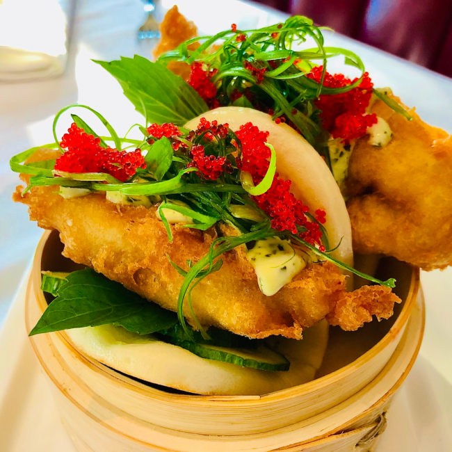 Lobster tempura BAO cucumber, green onion, sesame Thai basil aioli, red tobiko, steamed bun in a bamboo basket