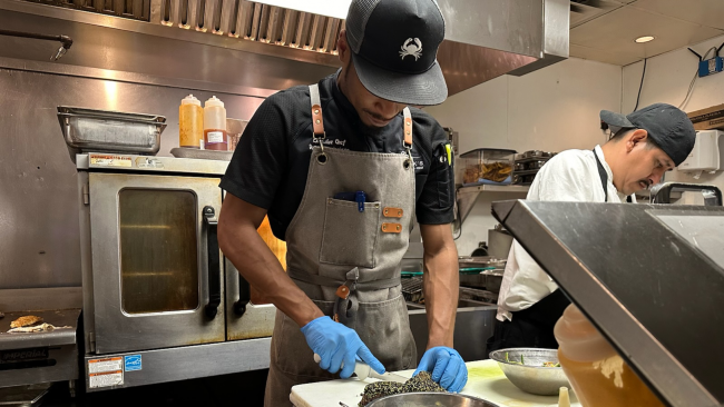 Chef Dom prepping some sesame tuna on the kitchen line