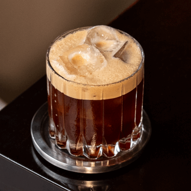 carajillo cocktail made with Licor 43 and Katz coffee, shaken and poured over ice into a rock glass